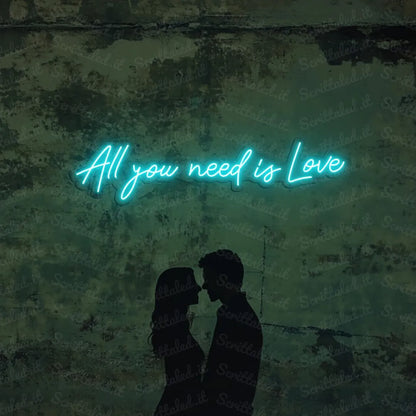 scritta neon all you need is love colore azzurro
