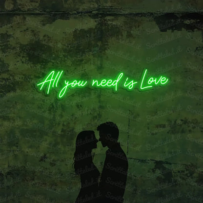 scritta neon all you need is love colore verde